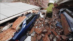 Cars crushed by rubble in a Christchurch suburb, 28 February 2011