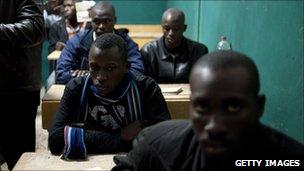 Alleged mercenaries from Mali and Nigeria, being held in a classroom by Libyan anti-government rebels in the western city of Zintan, 28 February 2011