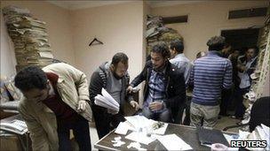 Egyptians search through secret papers