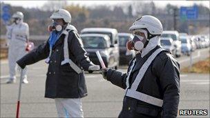 Police officers wearing respirators