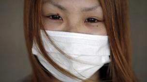 Woman outside Fukushima evacuation centre