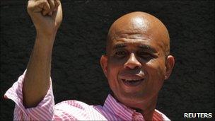 Haiti's presidential candidate Michel Martelly gestures to supporters after casting his ballot during presidential elections in Port-au-Prince in this March 20, 2011 file photo.