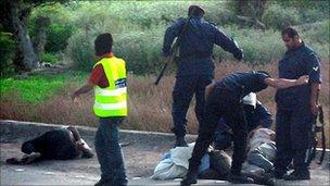 Police beat protesters in Bahrain, 30 March (obtained by a human rights group)