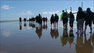 Pilgrims crossing the tidal causeway to Lindisfarne on Good Friday 2006. Photo: NorthernCross www.northerncross.co.uk