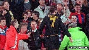 Eric Cantona walks off the pitch before confrontation with Matthew Simmons in 1995