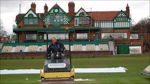 Terry Glover rolling a wicket infront of Liverpool Cricket Club