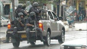 Armed police patrol Kingston, 24 May