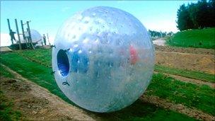 Sphereing, also known as zorbing