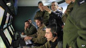 Israeli Defence Minister Ehud Barak visits the control room of an Iron Dome battery near the southern Israeli town of Beersheba (31 March 2011)
