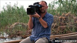 Swanage filmmaker, Stephen Foote, filming in southern Iraq. Copyright of Bruce Chadwick.