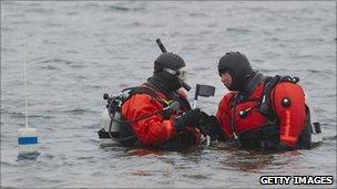 Police divers searching for bodies in waters along Ocean Parkway