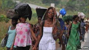 Families flee from the Abobo district of Abidjan on February 23, 2011. Photo by Issouf Sanogo/AFP/Getty Images