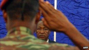 A picture taken on April 1, 2011 show a soldier saluting as Burkina Faso President Blaise Compaore meets armed forces representatives