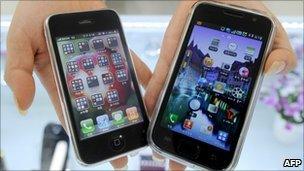 Apple's iPhone 3G (left) and Samsung Electronics' Galaxy S mobile phone (right)