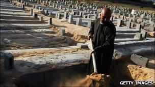 A gravedigger at work in Misrata, Libya, 19 April 2011