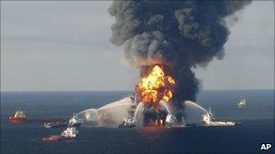 Fire boats spray water on to the Deepwater Horizon oil rig, which burned in the Gulf of Mexico last year