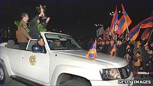 Armenian chess players celebrating a win