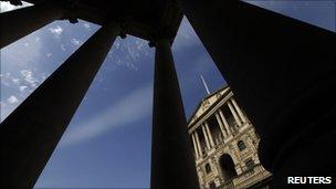 The Bank of England seen between pillars in the City of London