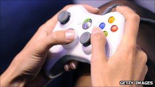 An Xbox controller in a gamer's hands
