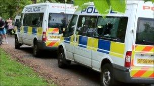 police vans with windows smashed