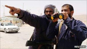 Rebel fighters at the Libyan/Tunisian border crossing of Dehiba