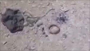 Grab from amateur footage showing a mine dropped by parachute in Misrata, May 2011
