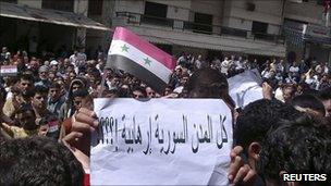 Banner saying "Are all Syrian towns terrorist?" at an anti-government protest in Baniyas (6 May 2011)