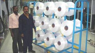 Workers at an Indian polyester recycling plant
