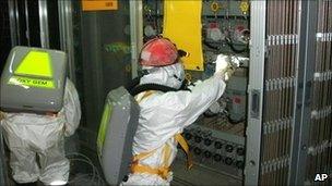 Workers check water level monitoring equipment inside reactor 1 at Fukushima Daiichi nuclear plant on 10 May 2011