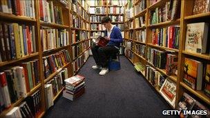 man sat in bookshop