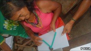 Mundurucu woman with geometry tool (P Pica)
