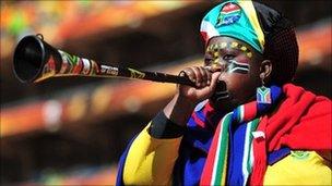 South Africa supporter blows a Vuvuzela
