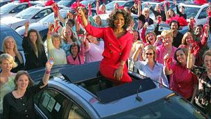 Oprah Winfrey with car winners