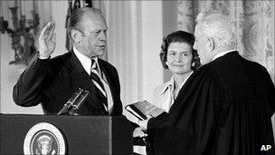Gerald Ford sworn in as President of USA, watched by Betty Ford