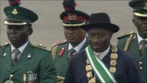 Goodluck Jonathan inspects a military parade during his inauguration ceremony