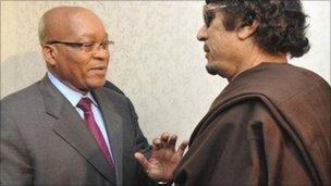 South Africa's President Jacob Zuma (L) greets Libyan leader Muammar Gaddafi - 30 May 2011