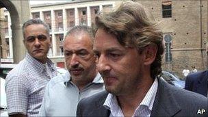 Giuseppe Signori (left, foreground) leaves police station in Bologna, Italy