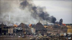 In this photo provided by the United Nations Mission in Sudan (UNMIS), homes burn in the center of Abyei town, Sudan - 28 May 2011