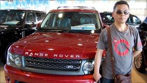 Li Hongquan with a Land Rover