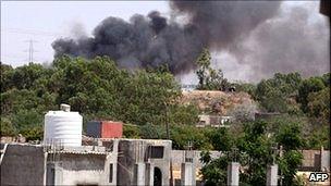 Smoke billows from Tripoli suburb after a Nato attack