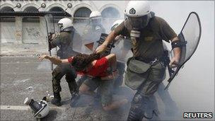 Protestors and riot police in Athens