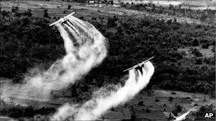 US Air Force planes spray Agent Orange over dense vegetation in South Vietnam, 1966