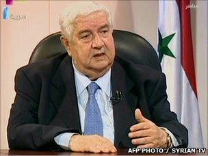 Syrian Foreign Minister Walid Muallem appears on state TV