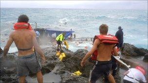 People clamber on the rocky shore on Christmas Island, Australia (file photo 15 December 2010)