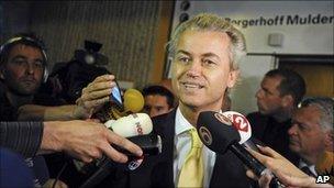 Geert Wilders speaks to reporters after his acquittal in Amsterdam, 23 June