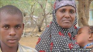 Somali mother and her two children in Kenyan refugee camp