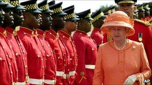 Queen Elizabeth II inspects a guard of honour in Kingston, Jamaica (19 Feb 2002)
