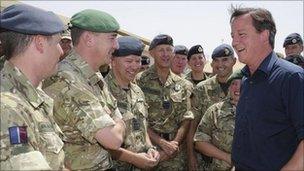 David Cameron talking to soldiers during a visit to Camp Bastion