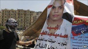A poster showing Mohammed Sayyed Abdelatif, killed in the January/February uprising, at Tahrir Square in Cairo, Egypt - 3 July 2011
