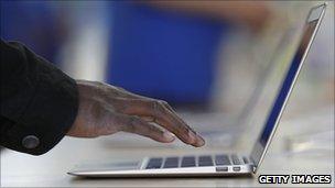 Hand typing on Macbook